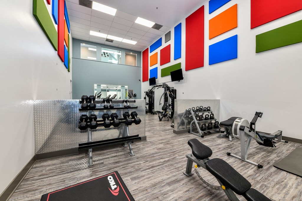a spacious fitness center with cardio equipment and free weights at 670 Thornton, Lithia Springs, Georgia