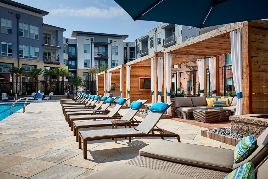 Poolside lounge chairs and cabanas at Inspire, North Carolina, 28211