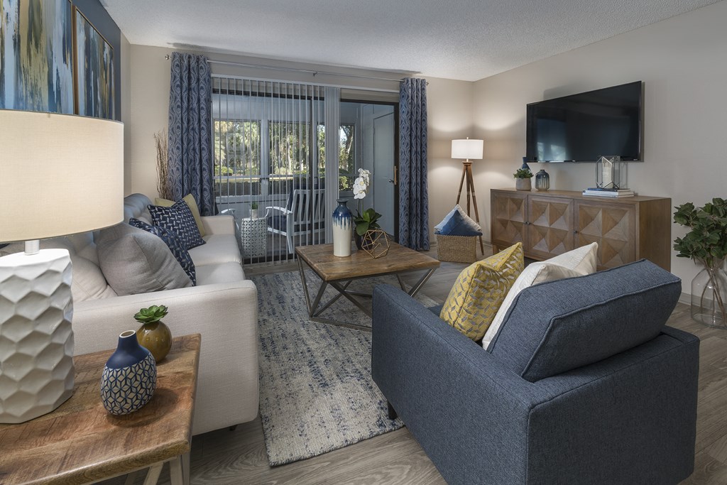 Living room with balcony access at Saddleworth Green, Ocala, FL 