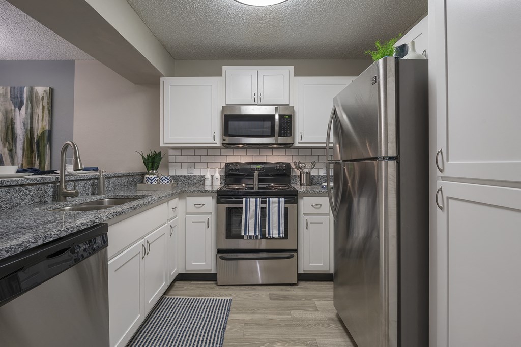 Kitchen with stainless steel appliances Kitchen with stainless steel appliances at Saddleworth Green, Ocala