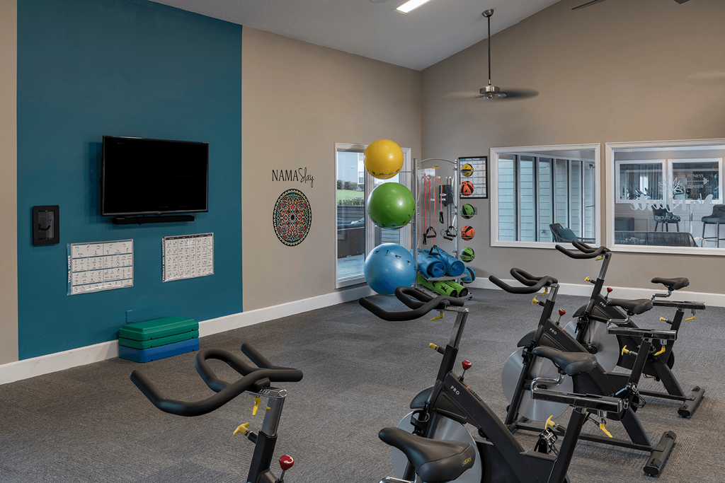 Fitness center with spin bikes at Saddleworth Green, Ocala