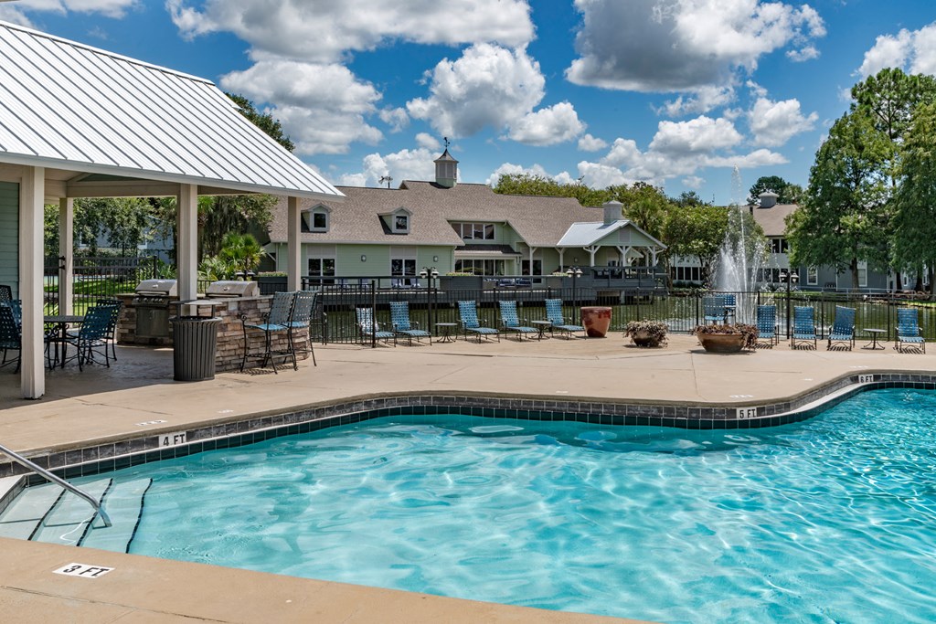 Community pool with covered lounge  at Saddleworth Green, Ocala, FL, 34474