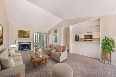Living room with a fireplace and couches at Great Hills, Austin, TX