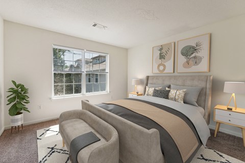 a bedroom with a bed and a chair and a window at Residences at Westborough Station, Massachusetts