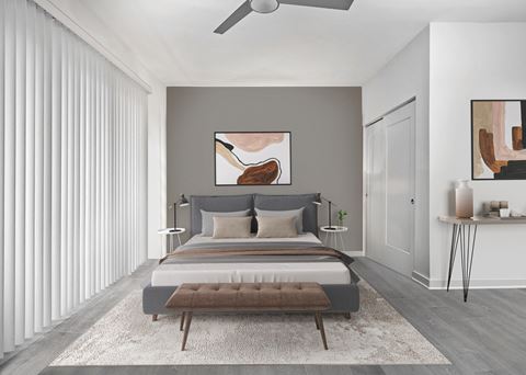 a bedroom with a bed and a ceiling fan at SLX Atlanta