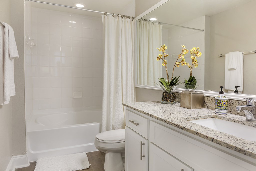 A white bathroom l at Floresta apartments in Jupiter, FL