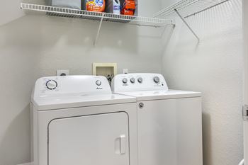 A white washing machine and dryer at Floresta, Jupiter, FL