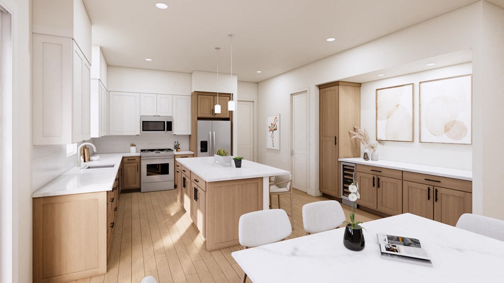 an open kitchen and dining room with a table and chairs