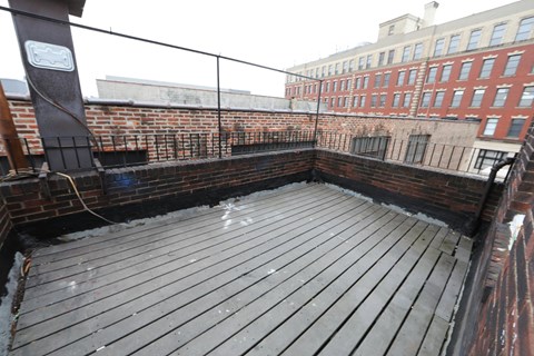 the roof deck of the apartment building is being remodeled