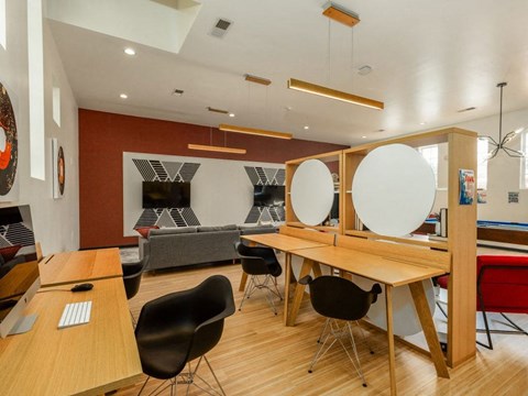 A conference room with a long table and chairs.