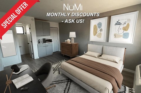 an image of a bedroom with a bed and a desk