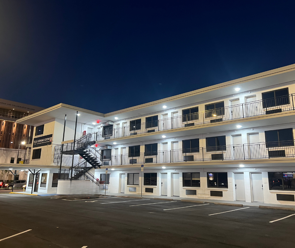 a building with a staircase in front of it at night