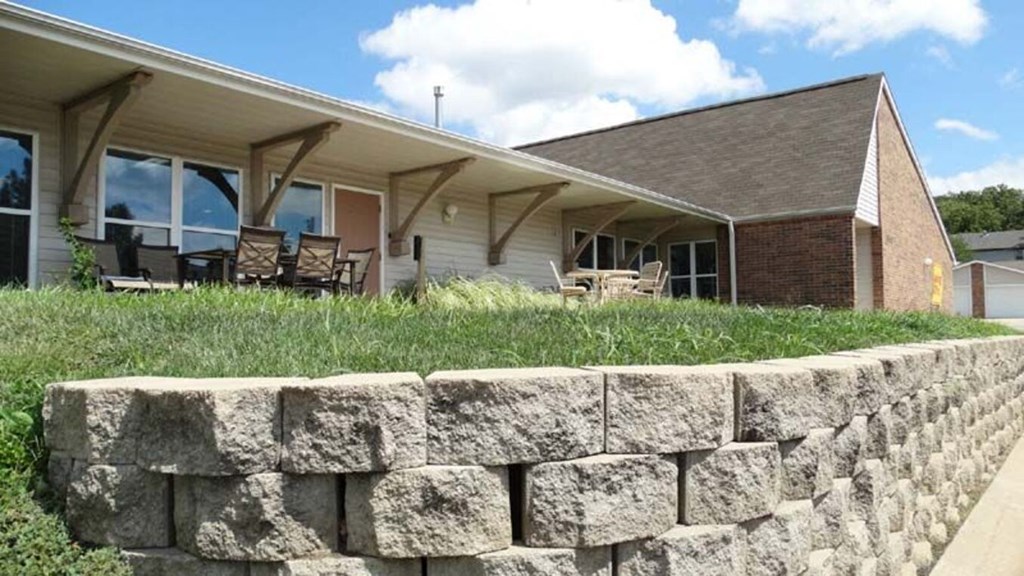 a reflection of a house in a glass window