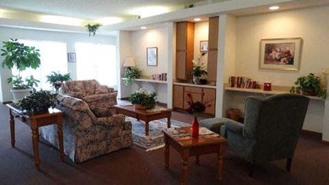a living room with couches chairs and tables