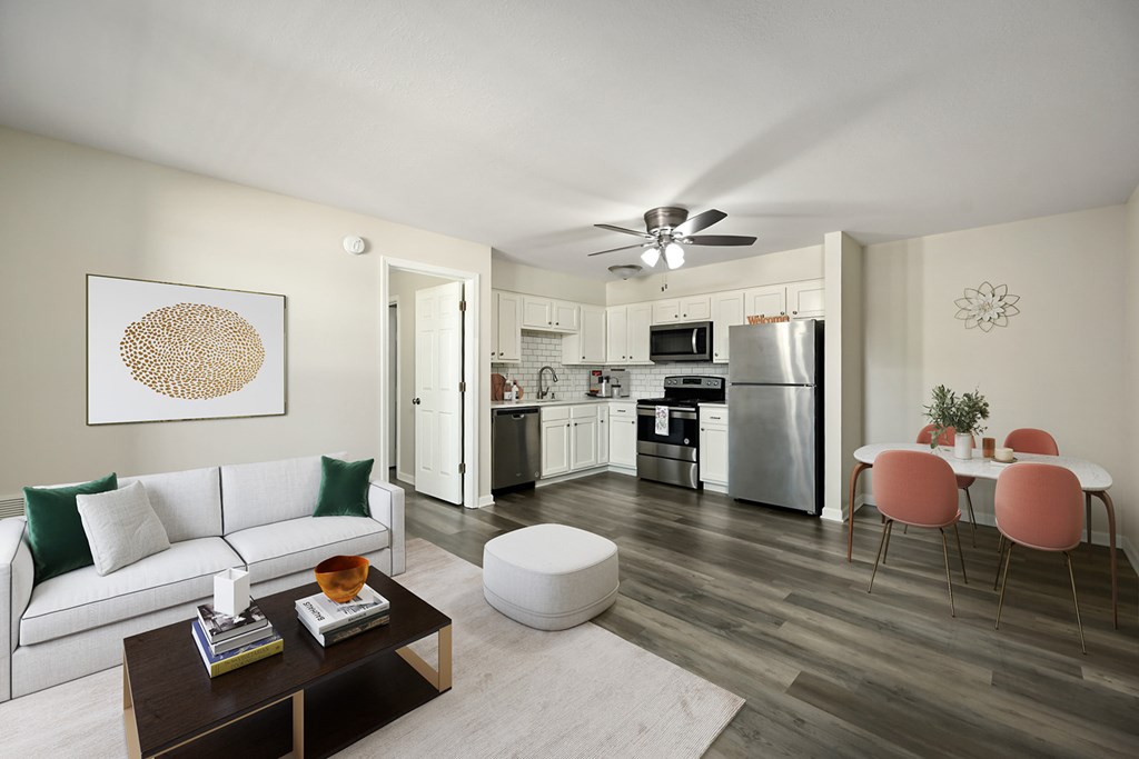 A modern living room with a white couch and a coffee table.