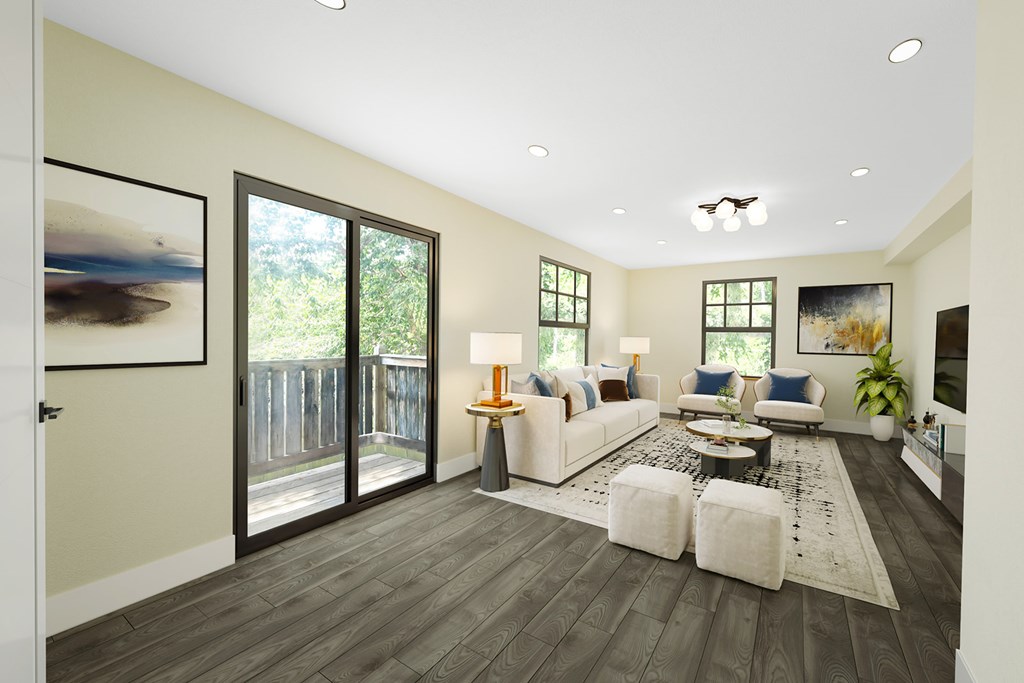 A living room with a white couch and a coffee table.