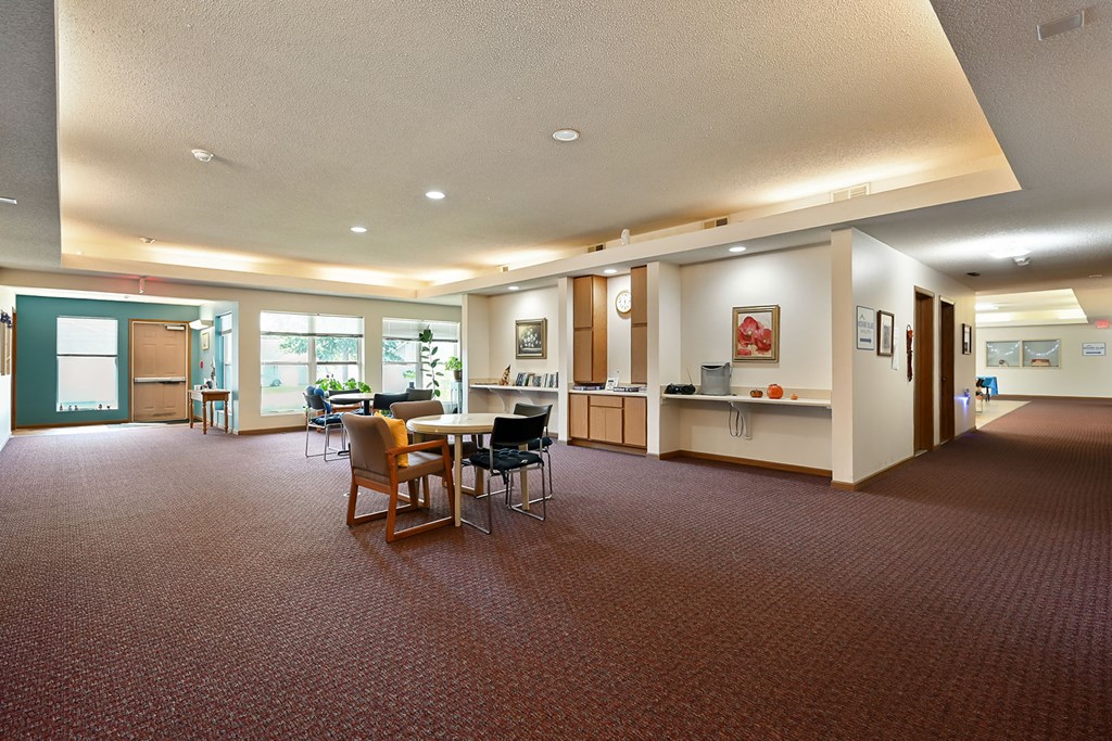 A room with a table and chairs in it.