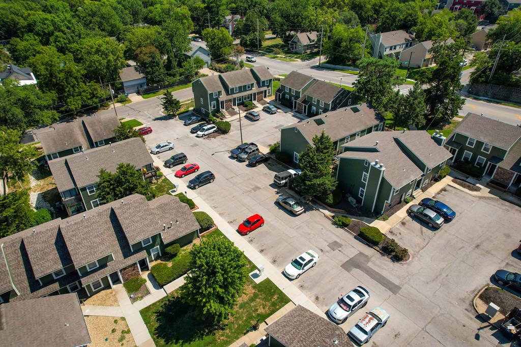 an aerial view of a neighborhood with houses and cars