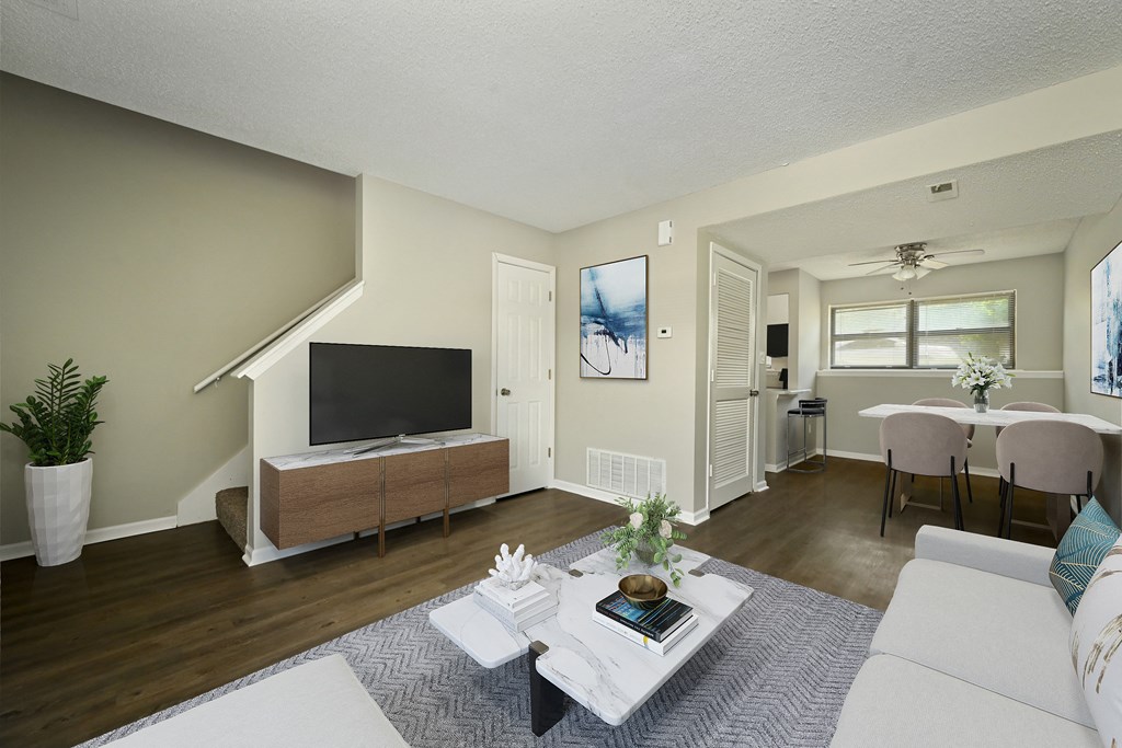 a living room with a couch and a table and a television