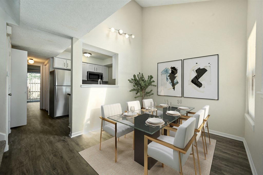 a dining room with a table and chairs