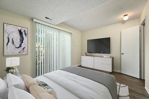 the preserve at ballantyne commons bedroom with large bed and tv