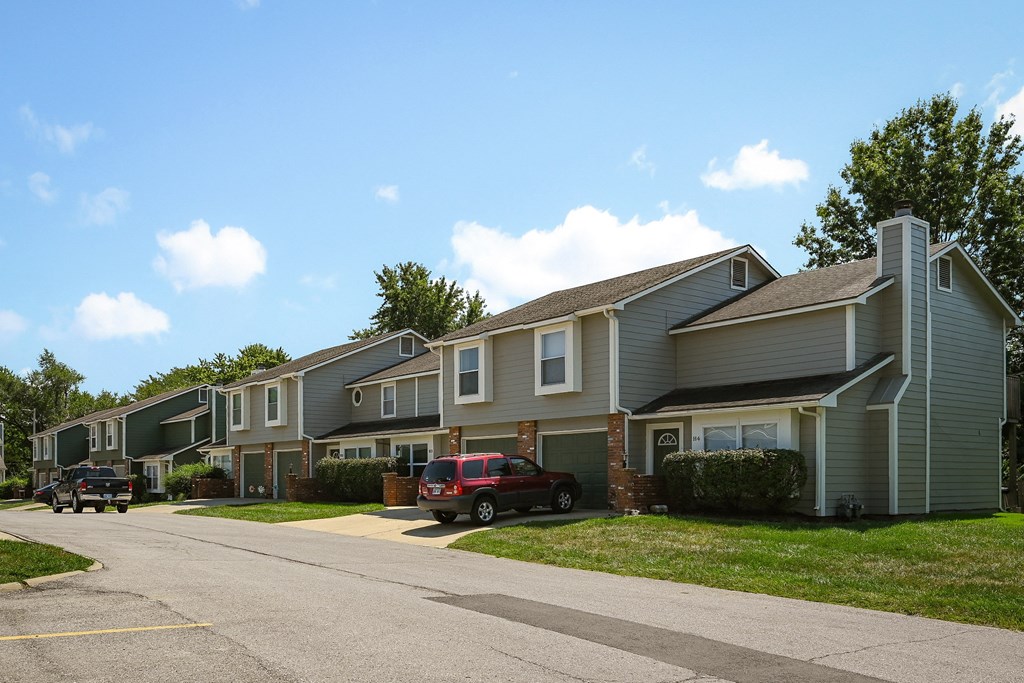 a row of houses on the side of a street