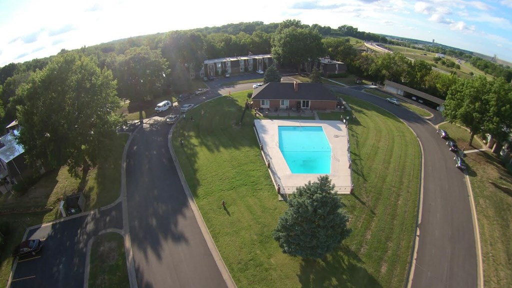 A bird's eye view of a house with a swimming pool.