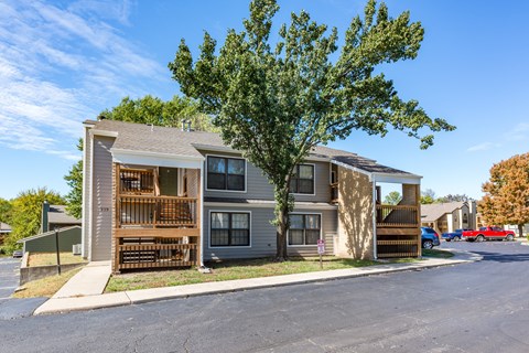 our apartments feature a spacious community area with a tree and balconies