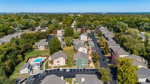 a aerial view of a neighborhood with houses and trees