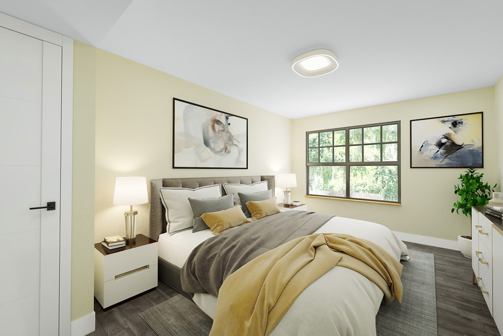 A bedroom with a bed, nightstands, and a window.