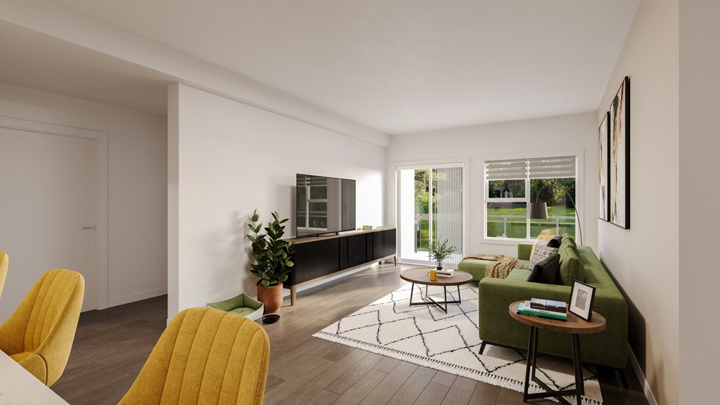 a living room with a green couch and yellow chairs