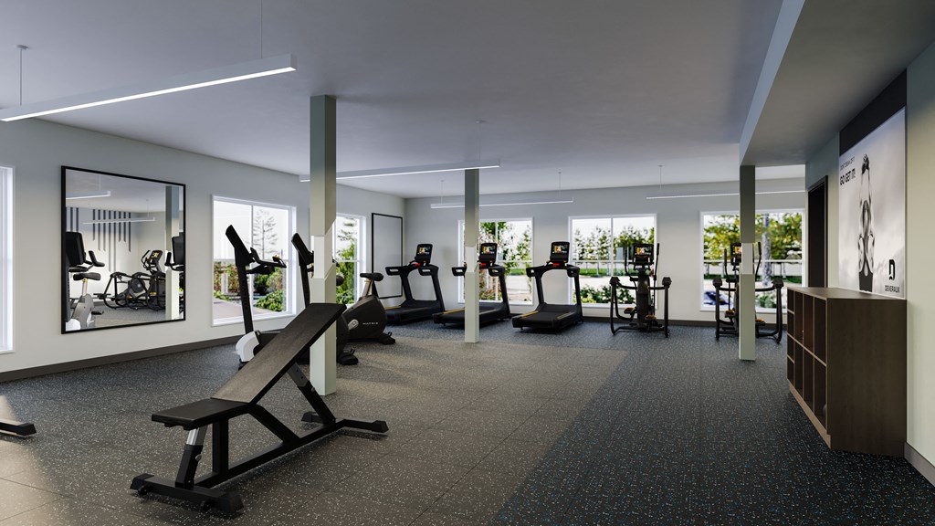 a gym with treadmills and other exercise equipment in a building