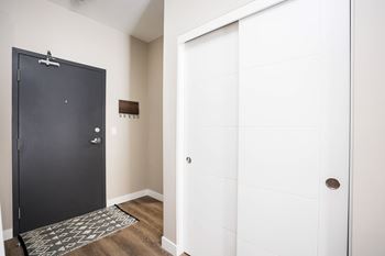 A black door is on the left and a white door is on the right.