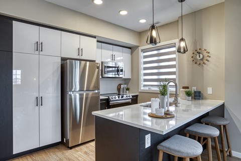 a kitchen with stainless steel appliances and a counter top