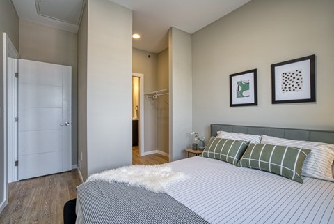a bedroom with a bed and a closet