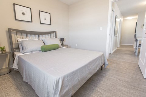 Bedroom with a large, white bed.