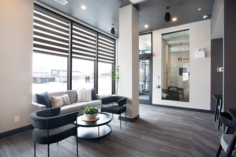 A modern waiting room with a view of the street outside.