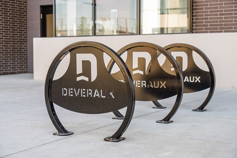 Three large metal signs with the word Deveraux on them.