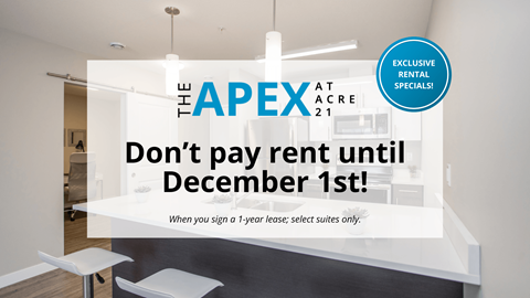 A sign advertising a rent-free period at The Apex at Acre 21.