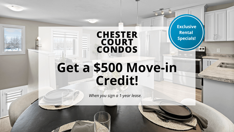 A kitchen interior with a sign offering a $500 move-in credit for Chester Court Condos.