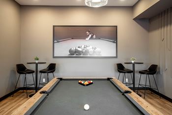 A pool table with a billiard ball in the middle of it.