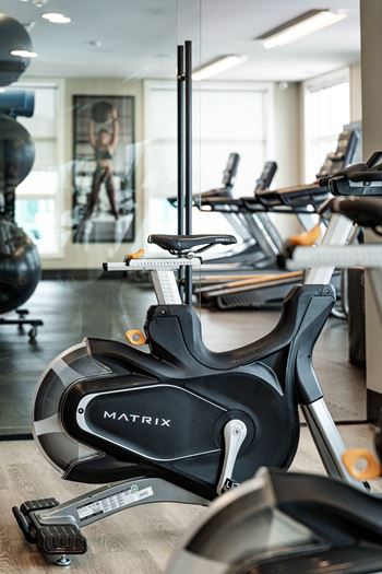 A black and silver exercise bike with the word MATRIX on it.