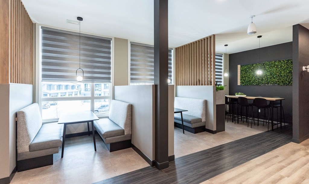 A modern room with a table and chairs.