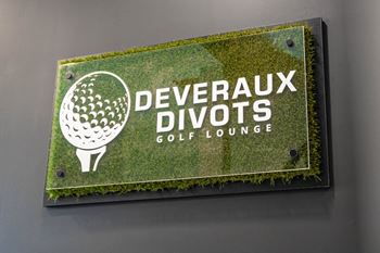 A sign for Deveraux Divots Golf Lounge is displayed.