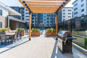A Patio With a Grill at Cadence at Griesbach, Edmonton