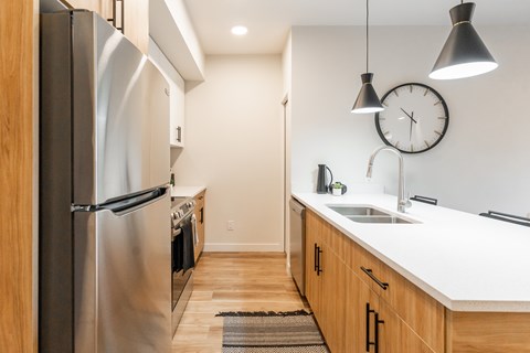 A Kitchen With a Refrigerator at Cadence at Griesbach, Edmonton, T5E 1Y8