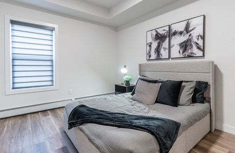 A Bedroom With a Large Bed at Cadence at Griesbach, Edmonton, Alberta