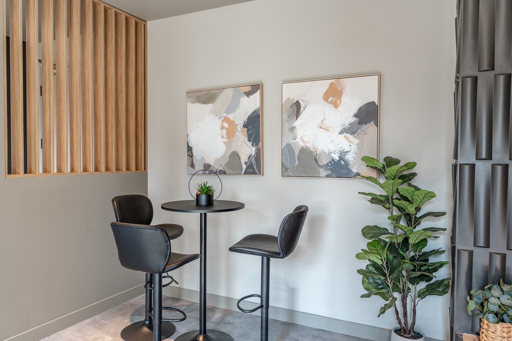 A room with a table and two chairs.