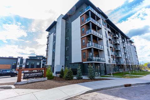 A large apartment building at Vibe Apartments at Arbour Lake, Alberta