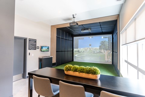 A modern dining room with a large table and chairs.